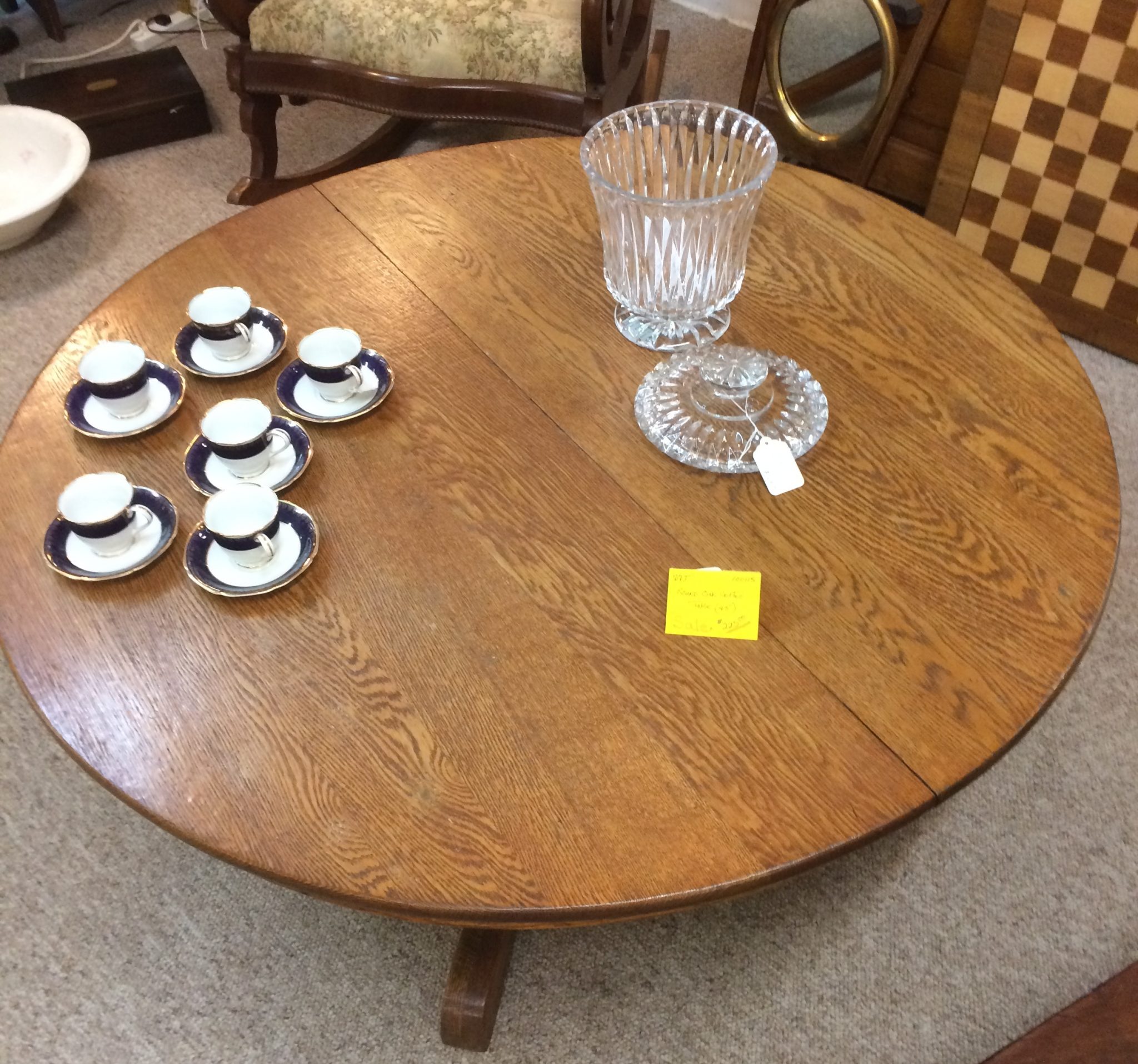 Round oak coffee table, set of 6 cups and saucers, covered glass spooner